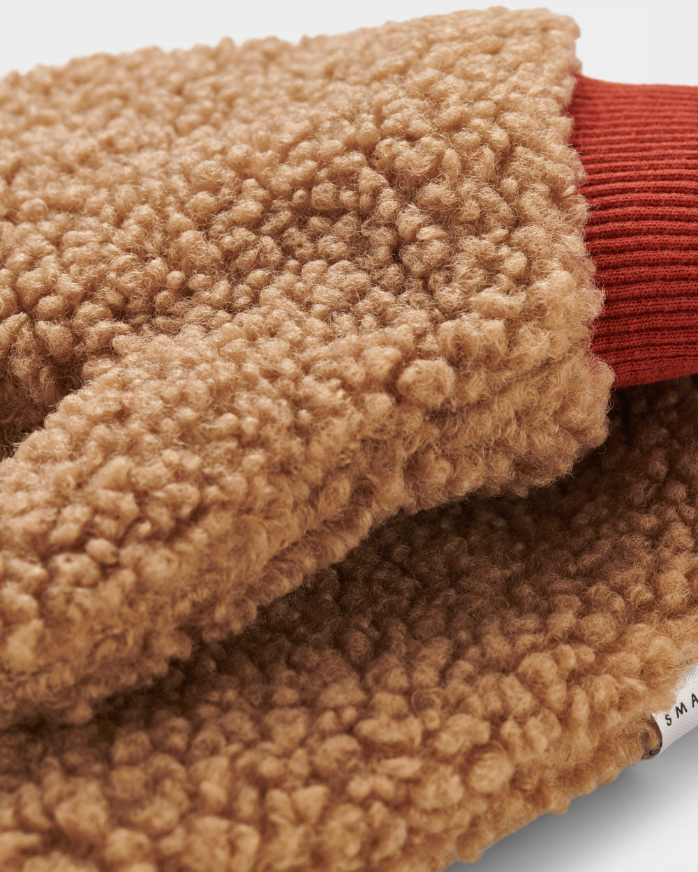 Brown borg mittens with contrasting cuff made from recycled materials. 